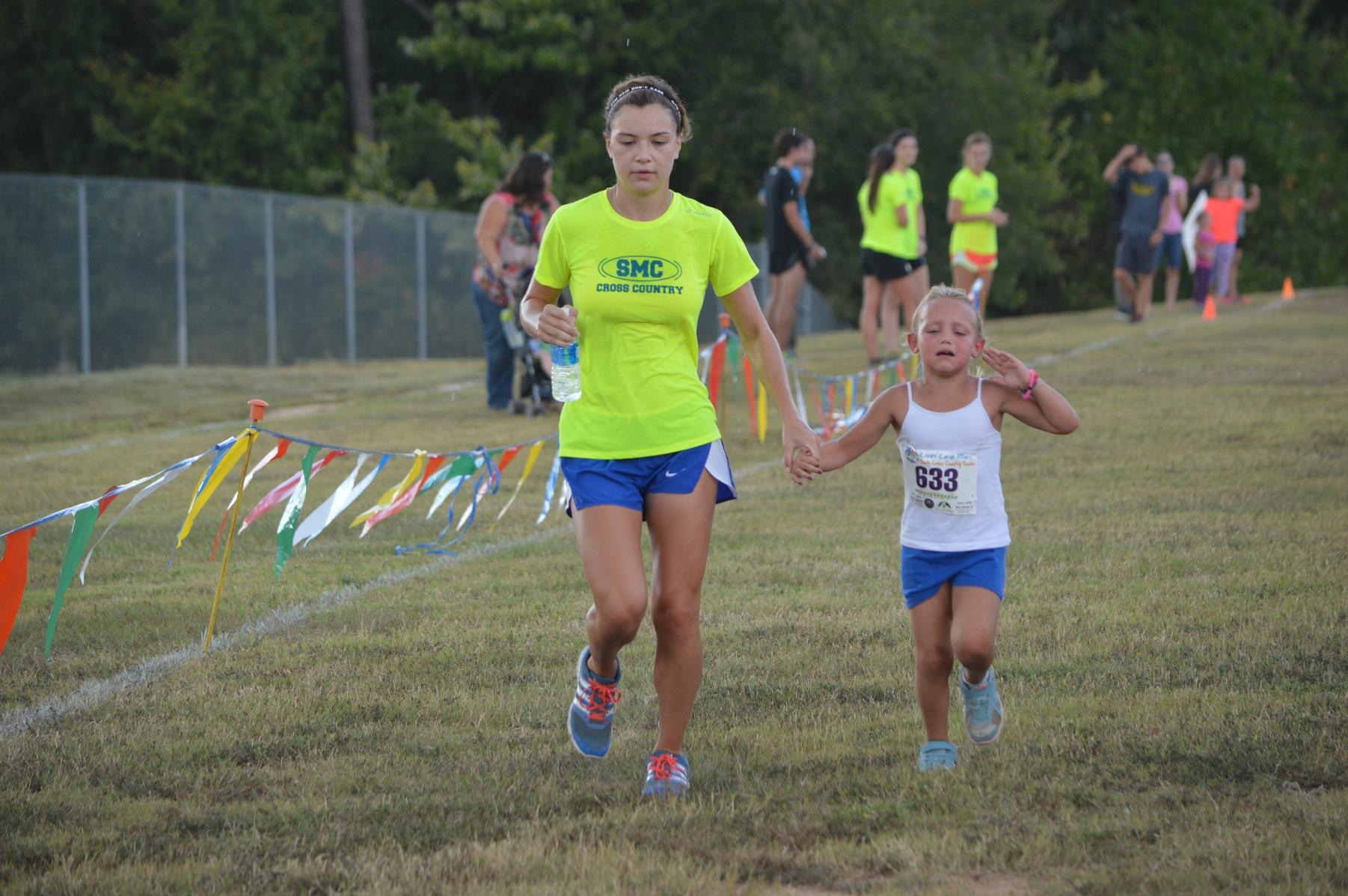 Women's Cross Country Team volunteers at youth event